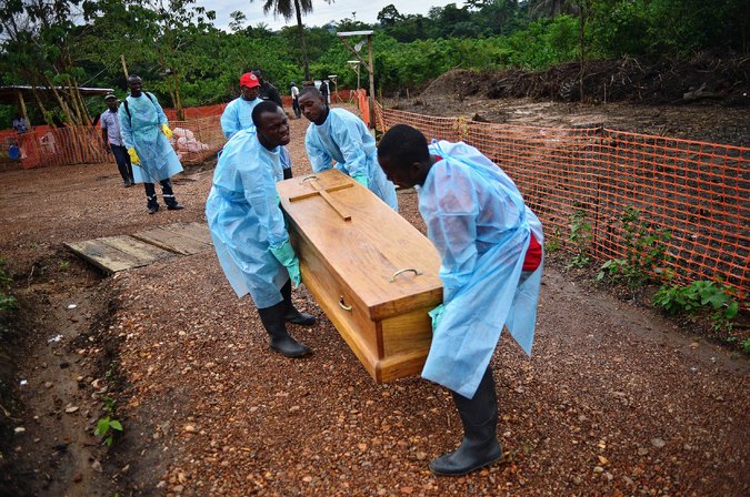  A government burial team in Sierra Leone. As Ebola claims more victims, false cures are being marketed toward Africans. Credit Carl De Souza/Agence France-Presse — Getty Images 